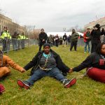 Protesters chain themselves to an entry point prior at the inauguration of Donald Trump in Washington