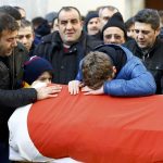 Relatives react at the funeral of Arik, a victim of an attack by a gunman at Reina nightclub, in Istanbul