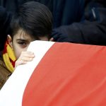Boy reacts at the funeral of Arik, a victim of an attack by a gunman at Reina nightclub, in Istanbul