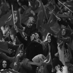 Supporters of the ruling AK Party wave Turkish flags during a campaign meeting for the April 16 constitutional referendum, in Ankara