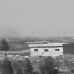 A still image taken from a video broadcast on Syrian state television on April 7, 2017, shows smoke rising from a Syrian army airbase that was hit by U.S. strike near the city of Homs