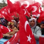 Supporters of Turkish President Tayyip Erdogan wave Turkey's national flags as they wait for the start of a rally for the upcoming referendum in the Kurdish-dominated southeastern city of Diyarbakir