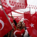 Supporters of Turkish President Tayyip Erdogan wave Turkey's national flags as they wait for the start of a rally for the upcoming referendum in the Kurdish-dominated southeastern city of Diyarbakir
