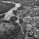 An aerial view shows a flooded area after heavy rains caused several rivers to overflow, pushing sediment and rocks into buildings and roads in Mocoa