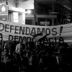 Demonstrators take part in a march to protest against a possible change in a law that would allow President Horacio Cartes to run for re-election, in downtown Asuncion