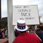 Demonstrators protest in response to President Donald Trump's refusal to make his tax returns public in Philadelphia, Pennsylvania