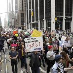 People march demanding President Donald Trump release his tax returns, in New York