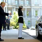 U.S President Donald Trump watches as Turkey's President Recep Tayyip Erdogan departs at the entrance to the West Wing of the White House in Washington