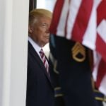 U.S President Trump stands in West Wing doorway waiting for Turkey's President Erdogan at the White House