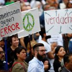 Muslims attend a rally to show solidarity against extremism, in Cologne