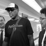 Former U.S. basketball star Dennis Rodman (C) arrives at Pyongyang's international airport, North Korea