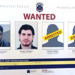 A poster from the Metropolitan Police is seen at a news conference in Washington