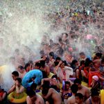 People cool off at a water park on a hot day in Wuhan