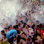 People cool off at a water park on a hot day in Wuhan