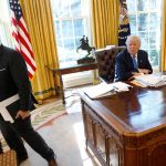 FILE PHOTO: White House Communications Director Spicer stands with President Trump at conclusion of Reuters interview at the White House in Washington
