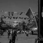 People walk under election posters and party flags in Istanbul