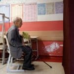 A man waits to vote during Turkey's presidential and parliamentary elections at a polling station in Istanbul