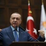 Turkish President Erdogan addresses members of his ruling AKP during a meeting at the parliament in Ankara