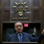 Turkish President Erdogan addresses members of his ruling AKP during a meeting at the parliament in Ankara
