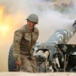An ethnic Armenian soldier fires an artillery piece during fighting with Azerbaijan's forces in Nagorno-Karabakh