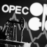 FILE PHOTO: A 3D printed oil pump jack is seen in front of displayed stock graph and Opec logo in this illustration picture