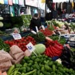 People shop at a local market in Fatih district in Istanbul