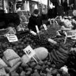 People shop at a local market in Fatih district in Istanbul