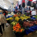 People shop at a local market in Istanbul