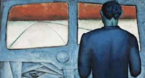 Back of a person in a blue jacket standing inside a blue vehicle, looking out two windows at a red sunset.