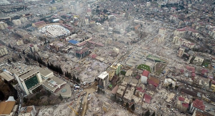 Aerial view of a city with widespread rubble and collapsed buildings after a disaster at an urban center area of destruction and debris scattered everywhere,