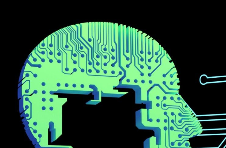 Side view of a human head made from a green circuit board pattern, representing artificial intelligence.