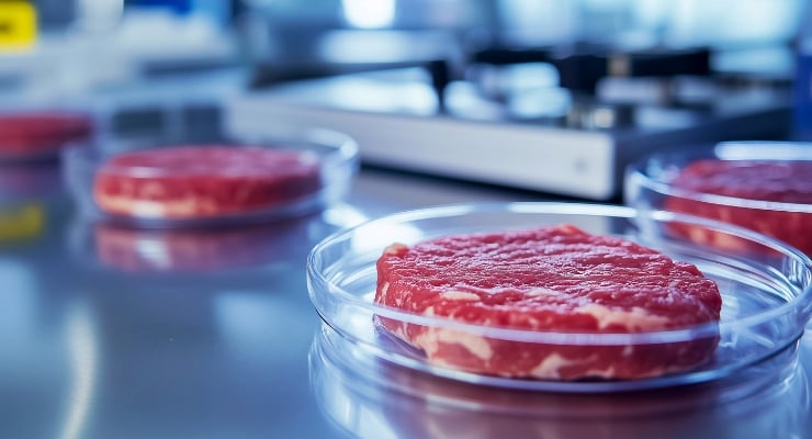 Raw beef samples in glass petri dishes on a lab bench with equipment in the background.