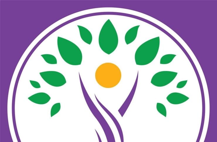 DEM PARTİ logo: white circular emblem with a stylized purple figure, green leaves, orange sun, on a purple background