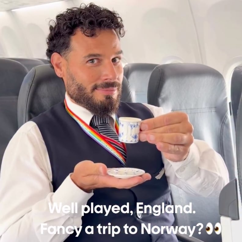 Smiling man in a vest and tie on a plane holds a small teacup and saucer, rainbow lanyard visible, caption suggests England and Norway joke.