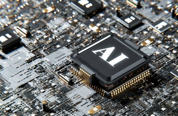 Close-up of a computer circuit board with a prominent AI processor at the center.